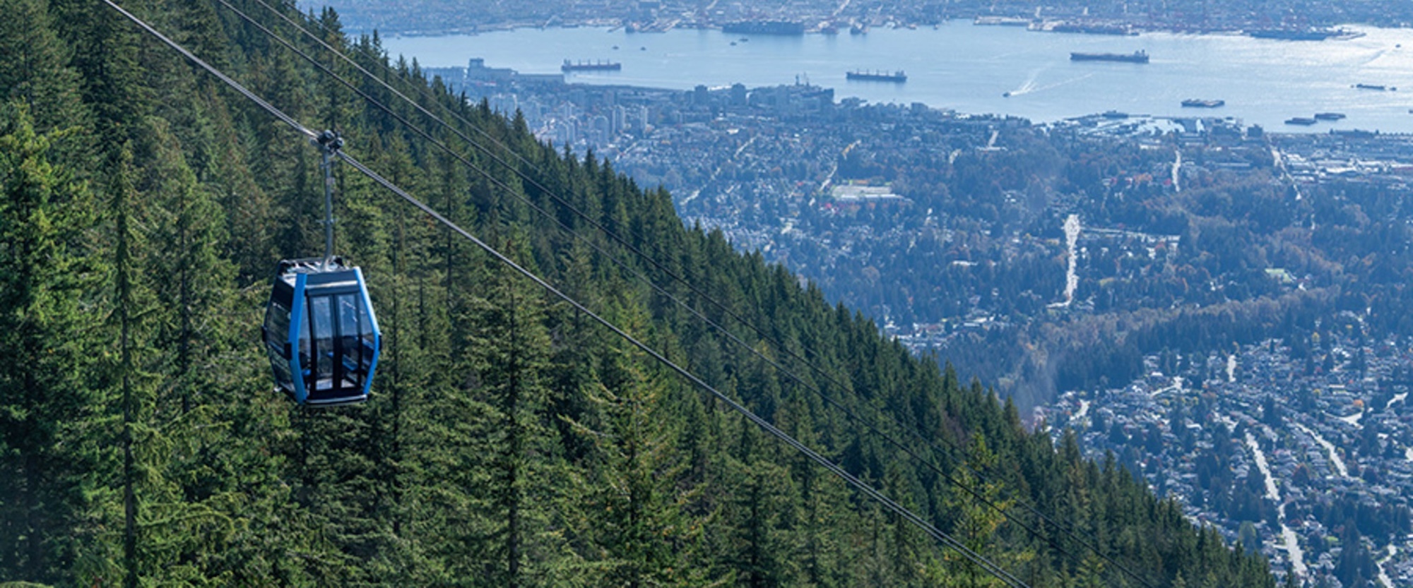 https://discovervancouvertours.com/wp-content/uploads/2025/04/©Grousemountain-Bluegondola-1.jpg